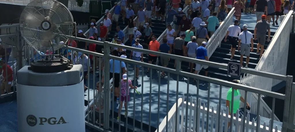 PGA misting fan cools golf crowd.